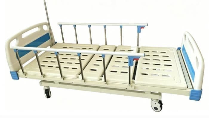 Electric hospital bed, back raised, with rails and casters